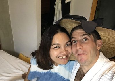 honeymoon couple travelers fun selfie inside of Butterfly Pea hotel room