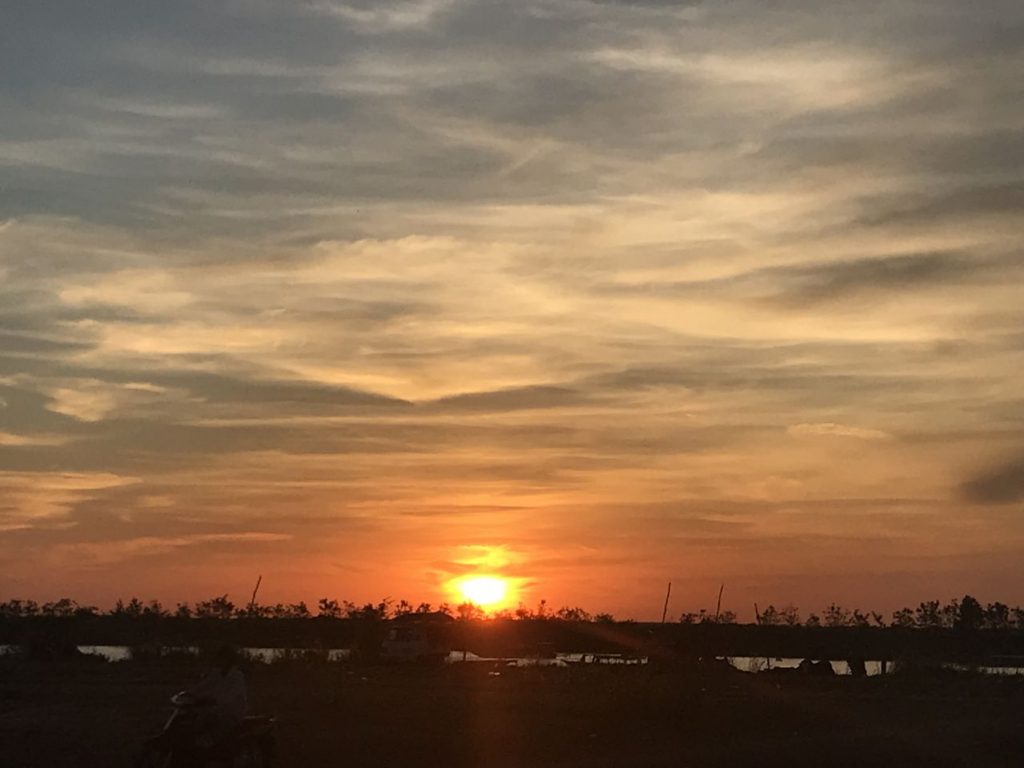 Cambodian sunset in Siem Reap setting over the countryside